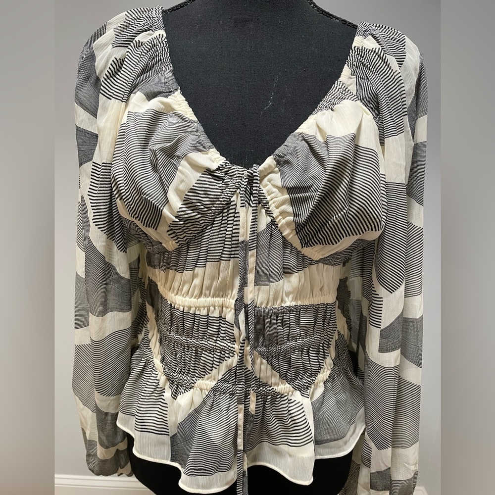 Black and cream peplum top with ties